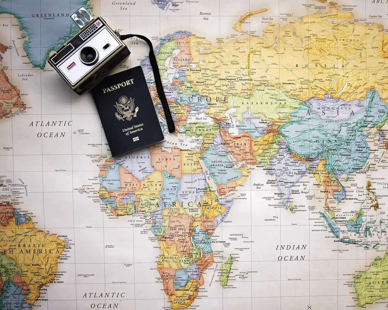 passport, map, world, world map, trip, tourism, vacation, travel, planning, camera. Does BC's PIPA change what a Victoria tourism business must report?