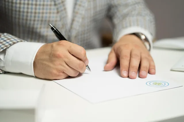 man, sign, paper, write, document, contract, signing, agreement, signature, signing document, signing contract, signing paper, sign, contract, contract, contract, contract, contract, signing, agreement, signature, signature. Breaking an industry license question into activity, person and premises